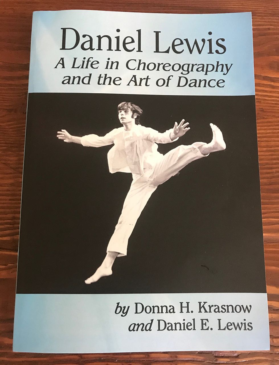 The cover of the book, featuring a black and white photo of Lewis jumping