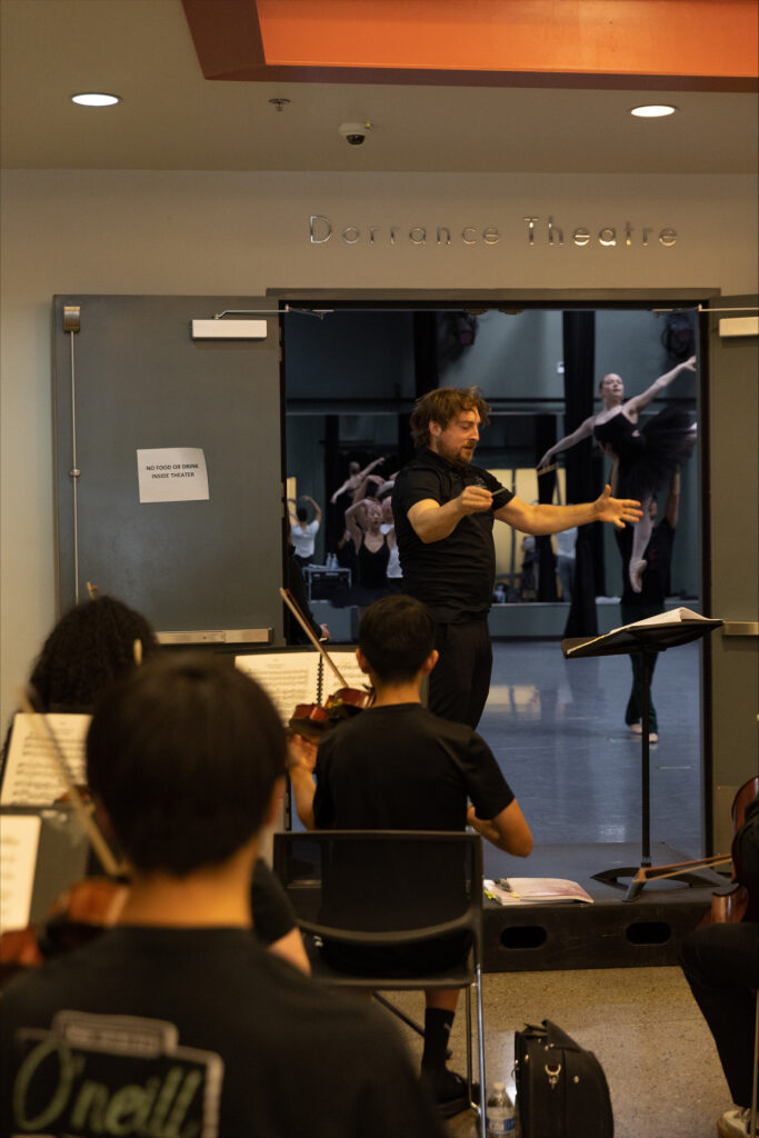 Matthew Kasper leads the Phoenix Youth Symphony Orchestra during a rehearsal for Raymonda with School of Ballet Arizona.