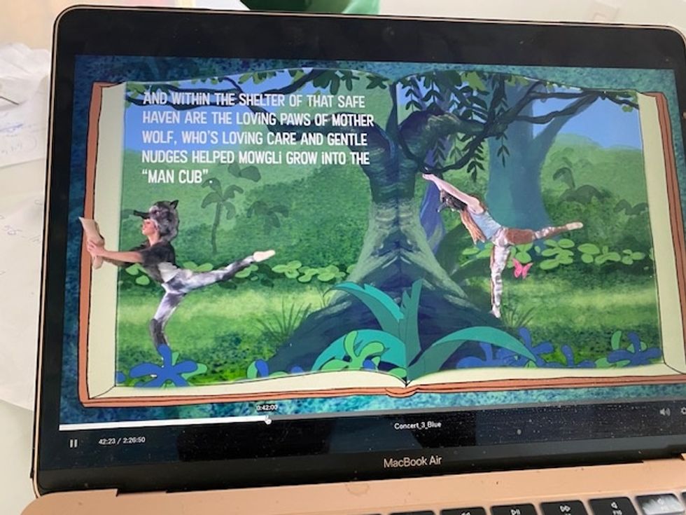 Gotta Dance's virtual recital plays on a laptop screen. Dancers in animal costumes dance across an animated jungle, and text telling the story of the Jungle Book is overlaid.