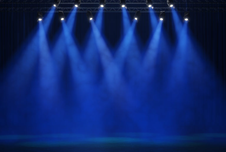 A empty stage lit with blue light