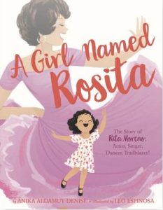 The cover of "A Girl Named Rosita." It shows an illustrated young Rita Moreno dancing, and an older Rita, in costume for West Side Story, dancing behind her.