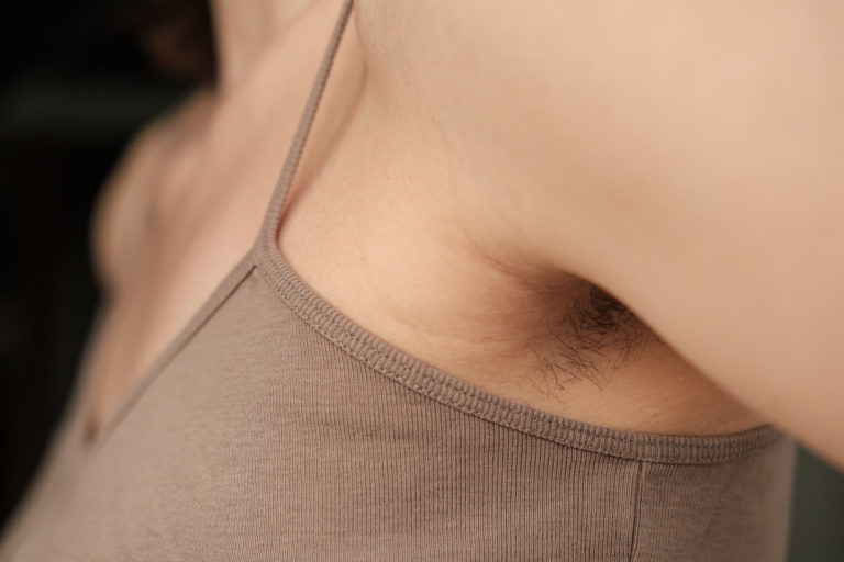 Close up of hairy, unshaven female armpits