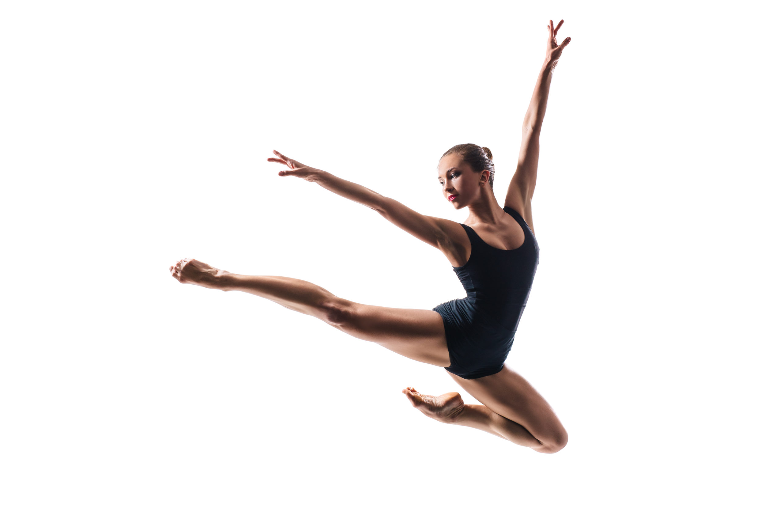 Ballet dancer jumping high against white isolated background