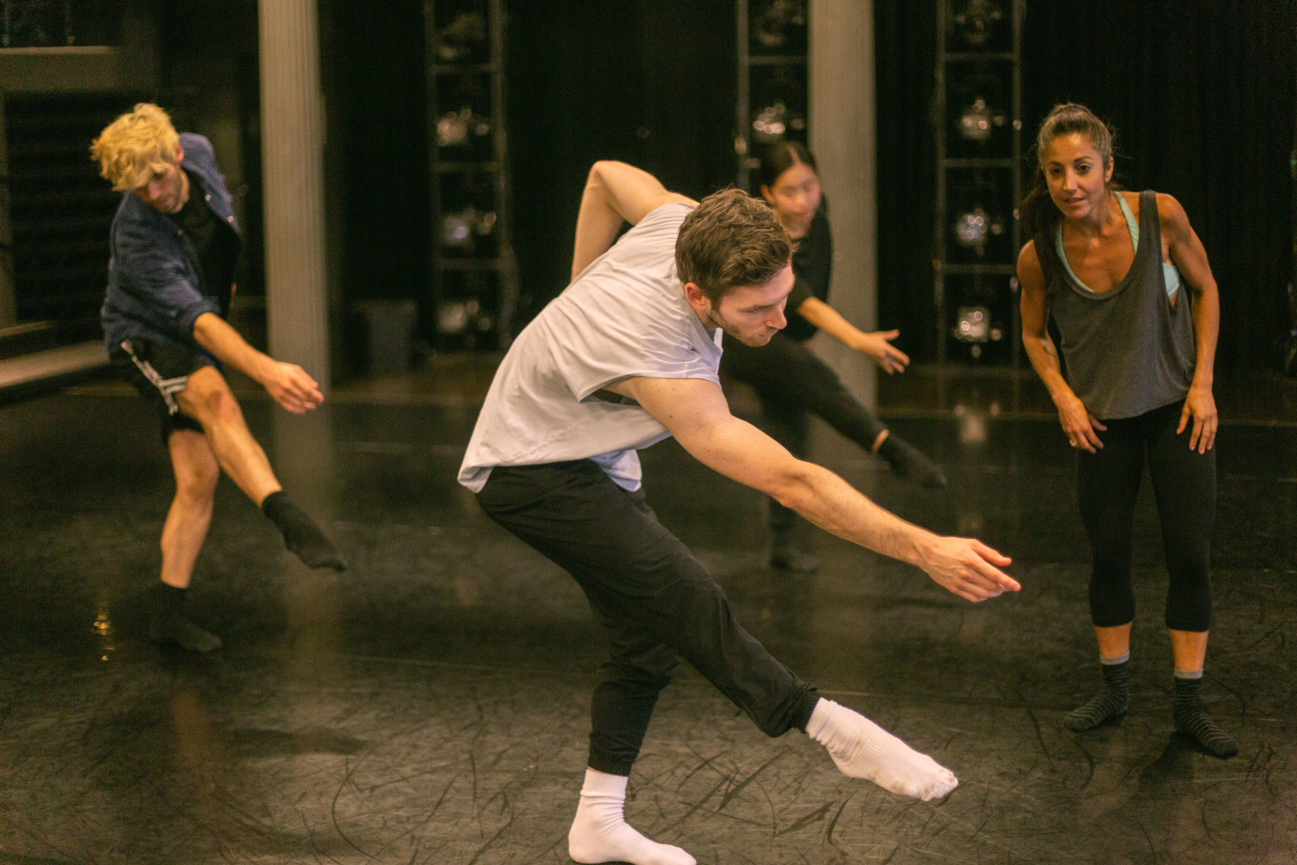 Image of dance instructor with a group of adult students