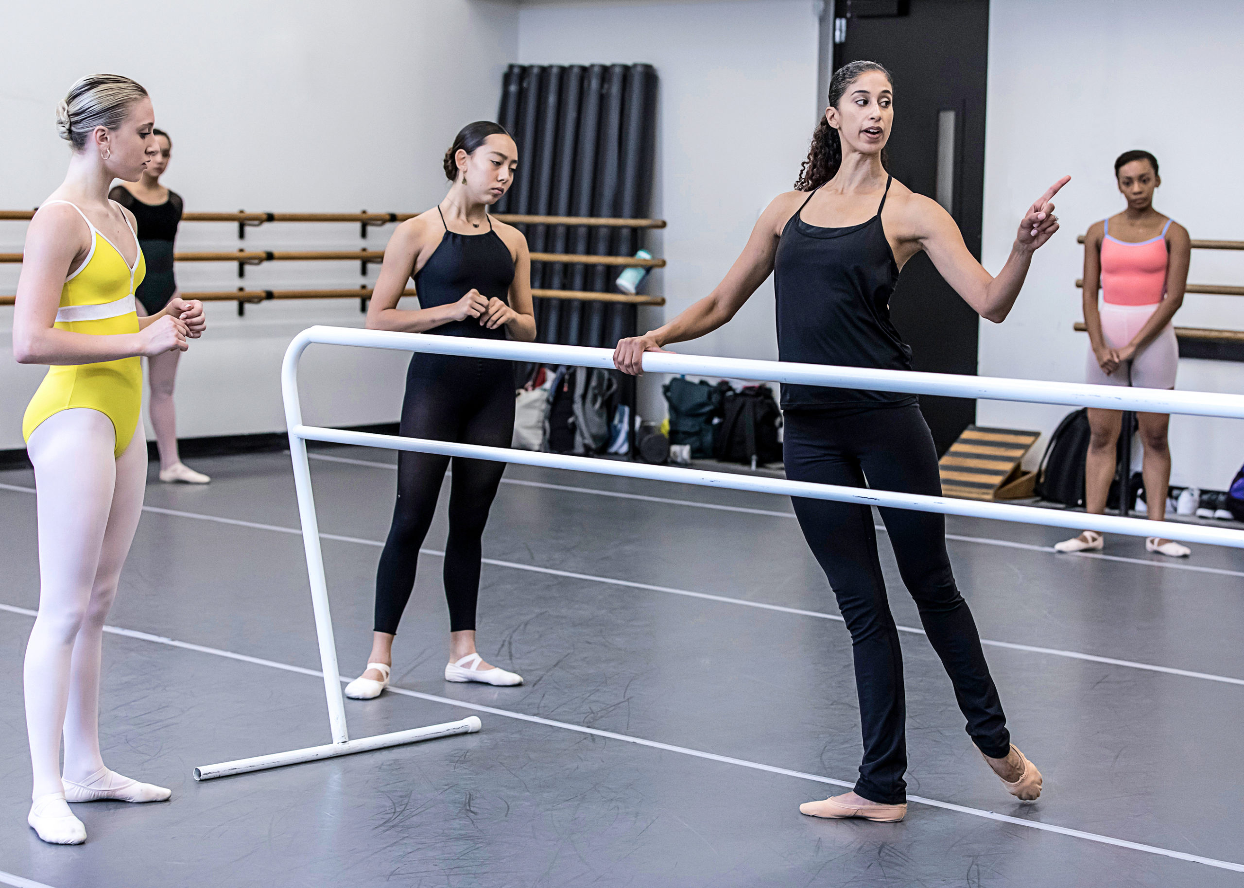 Alicia Graf Mack instructing a group of ballet students at the barre