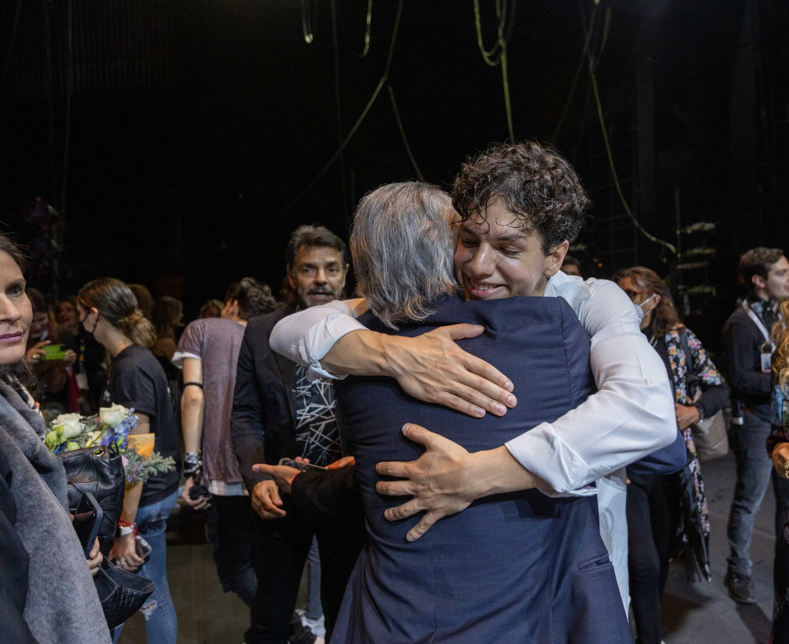 Image of dancer hugging his dad backstage