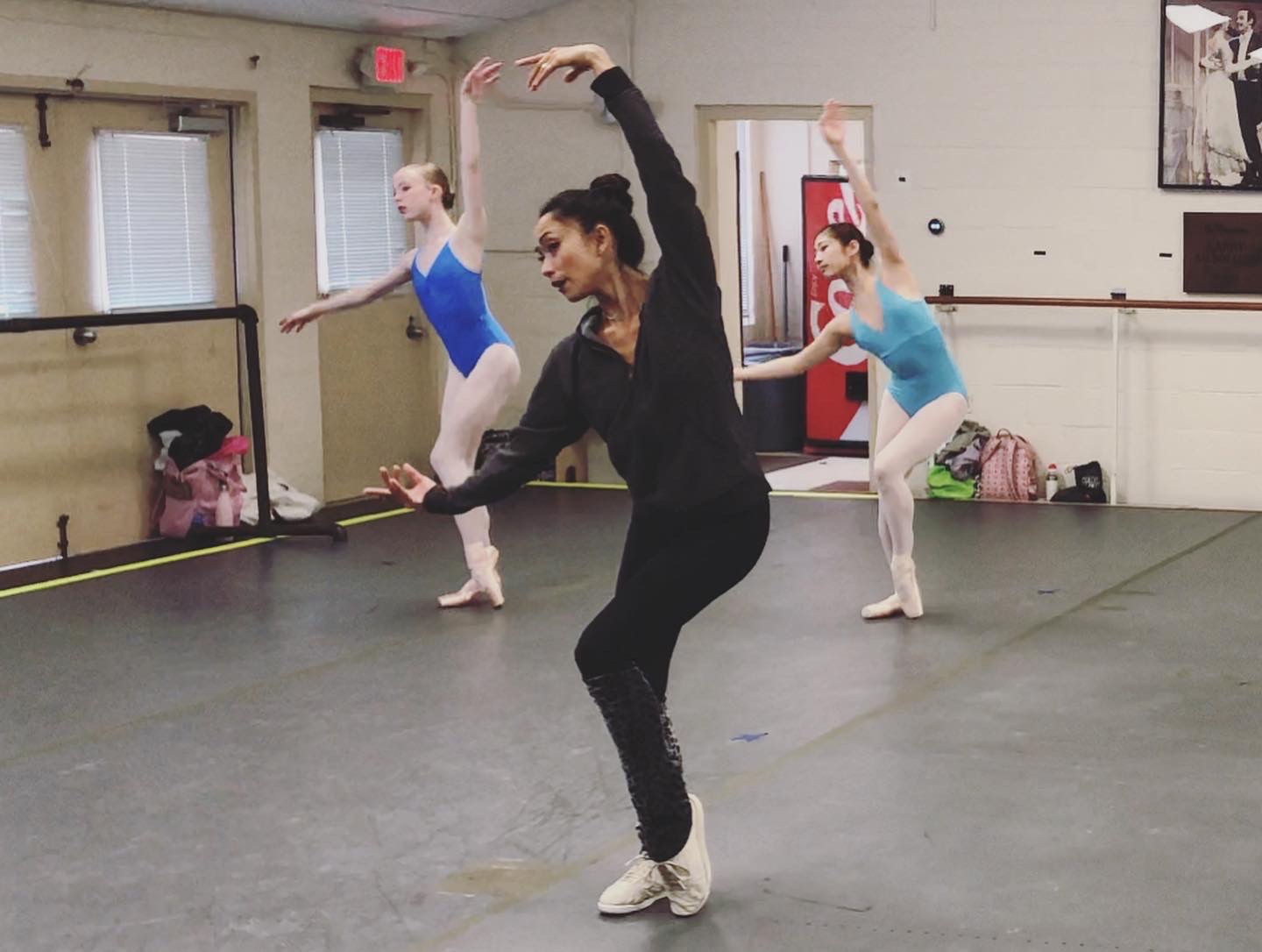 Stella Abrera teaching two ballet students