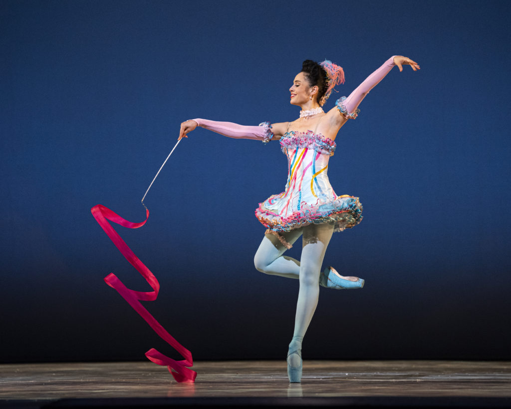 Ludmila Bizalion in Tomasson's Nutcracker dancing on stage with a ribbon prop.