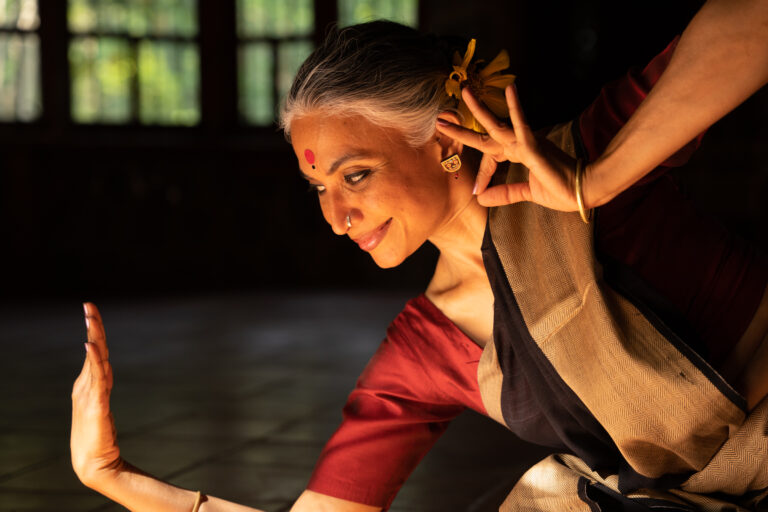 Odissi dancer and dance educator Bijayni Satpathy holding a pose.