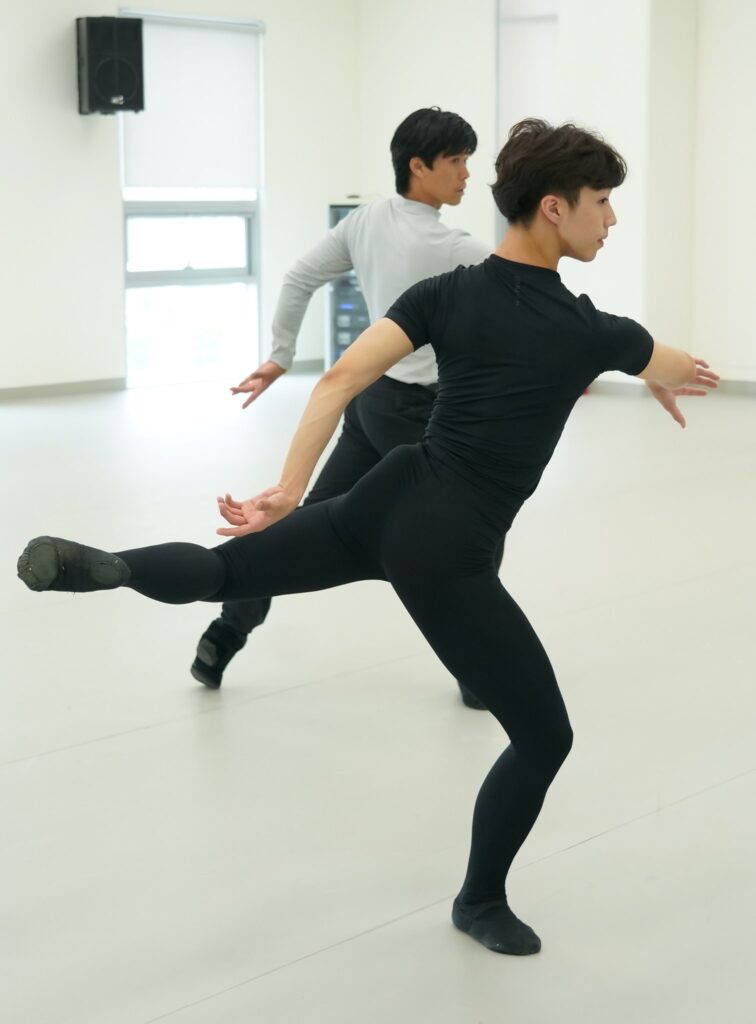 Dance educator Jay Jong-Hoon Kim teaching a ballet student.