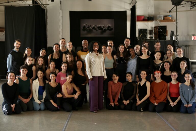 Dance educator Ashley Brown with her students in a group photo.