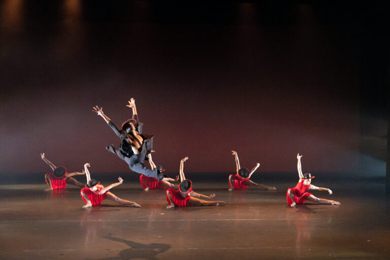 Dancers performing on stage.