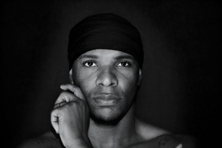 Black and white headshot of Kieron Dwayne Sargeant.