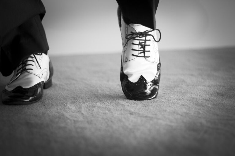 Black and white image of dancer's feet wearing tap/jazz shoes in black and white.