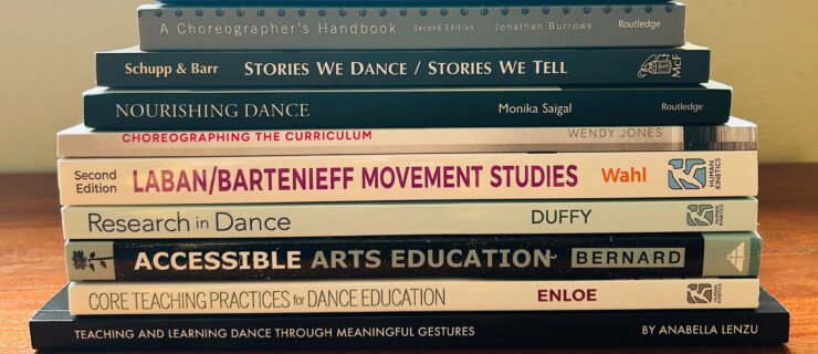 Image of a stack of dance pedagogy books