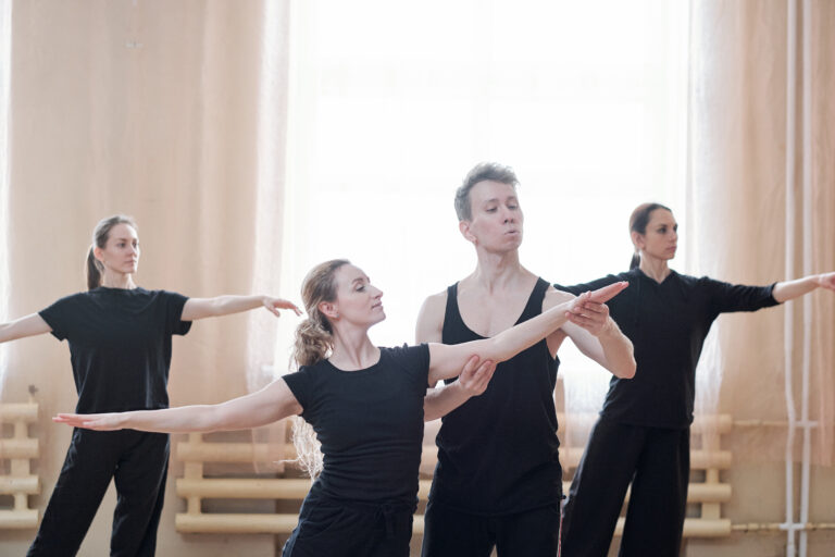 Three women rehearsing in their contemporary dance school.