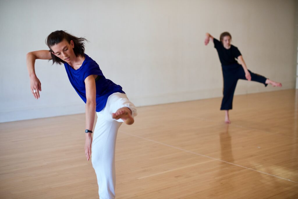 Cecily Campbell rehearsing with a student in the studio.